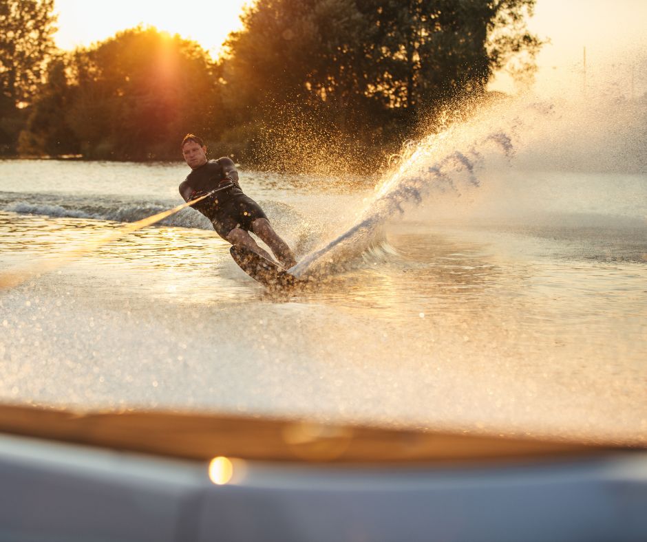 a guy water skiing on the lake