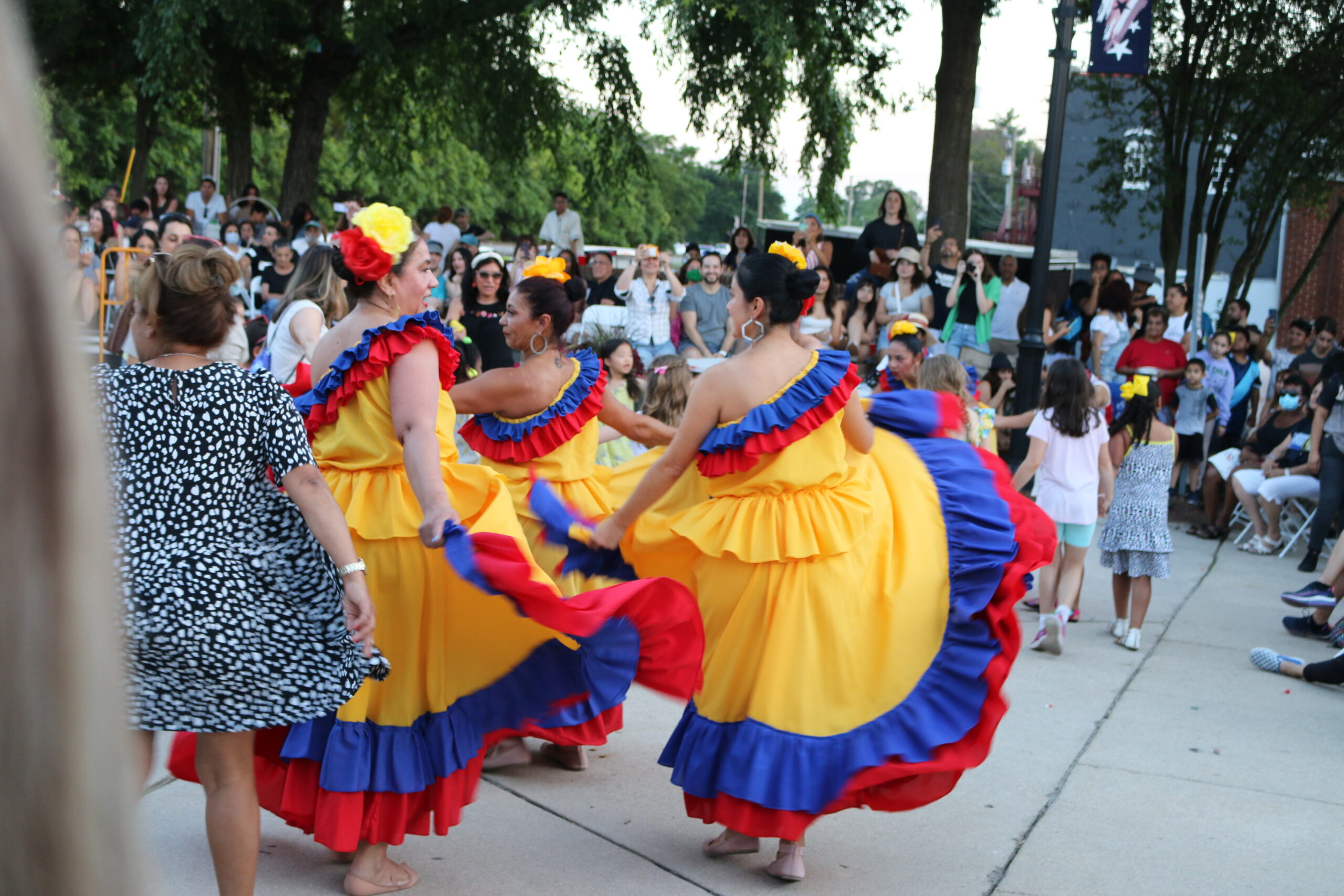 two women dancing at festival