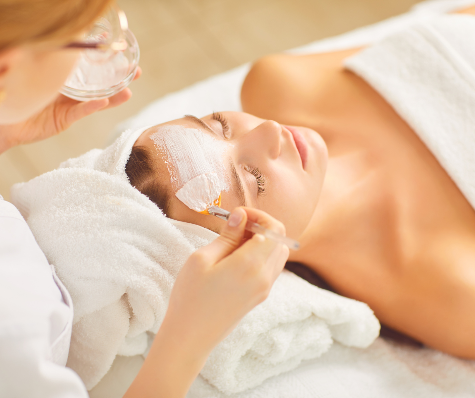 a lady getting a face mask put on