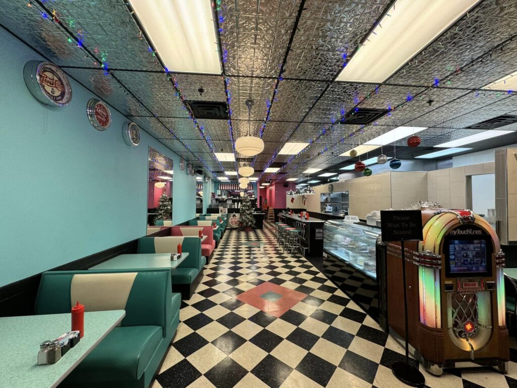 diner with light blue walls and checkered tile floors