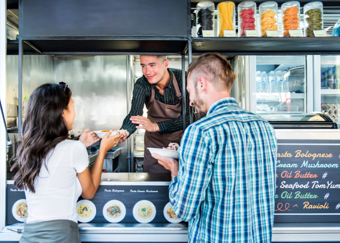 two people ordering at a food truck