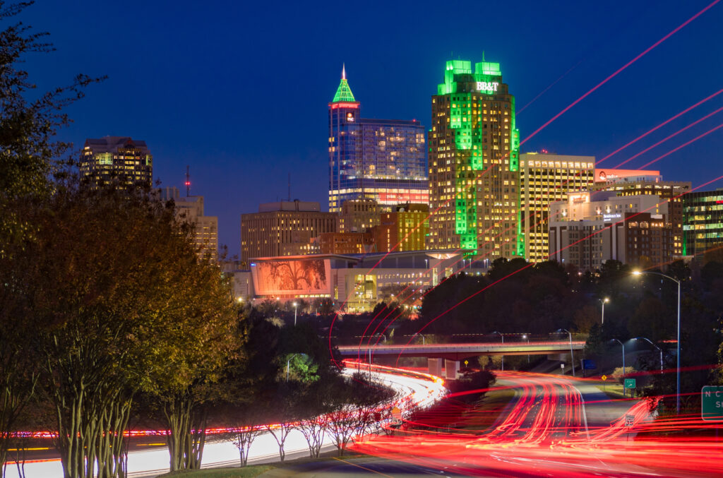 downtown raleigh skyline lit up at night