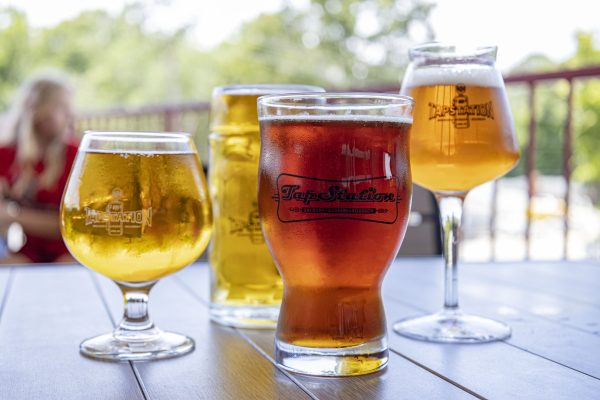 multiple beers on a table outside